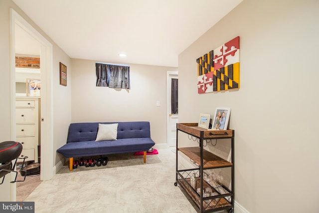 living area featuring recessed lighting and baseboards