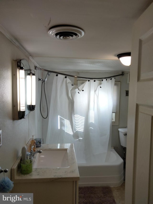 bathroom with shower / bathtub combination with curtain, toilet, visible vents, and vanity