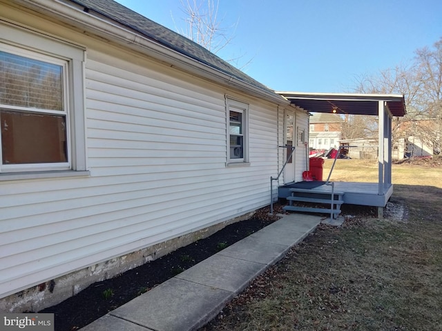 view of home's exterior featuring a shingled roof