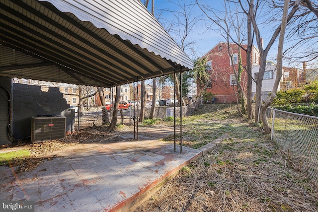 view of yard featuring cooling unit and fence