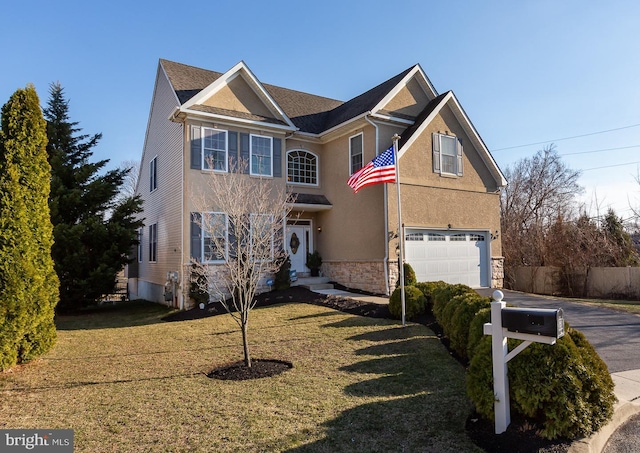 traditional-style house featuring stucco siding, a front lawn, stone siding, fence, and a garage