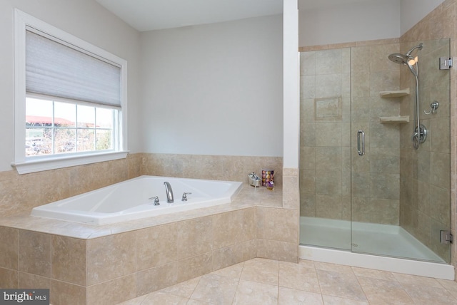 full bath with a bath, a shower stall, and tile patterned flooring