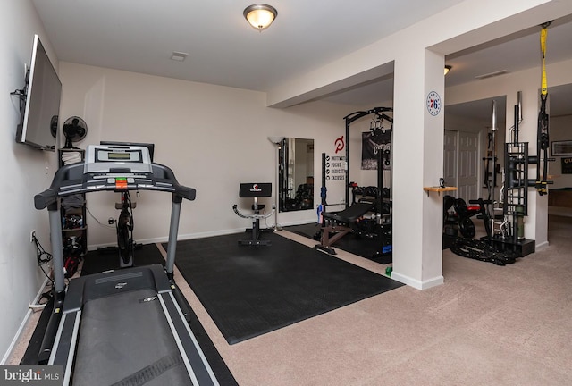 exercise area with carpet flooring, visible vents, and baseboards