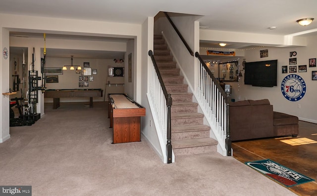 stairs with carpet flooring and pool table