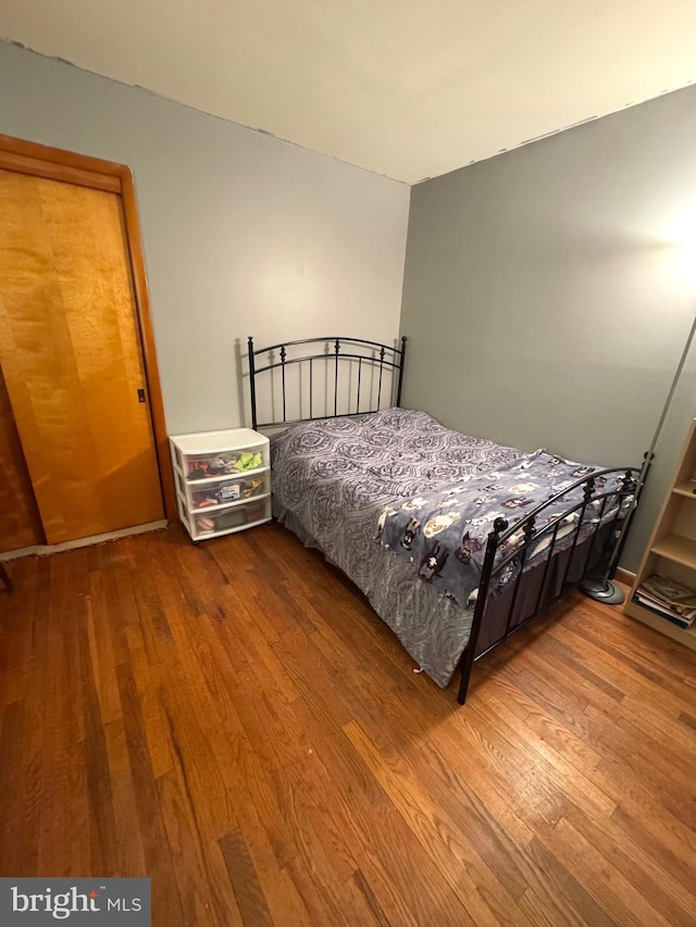 bedroom featuring wood finished floors