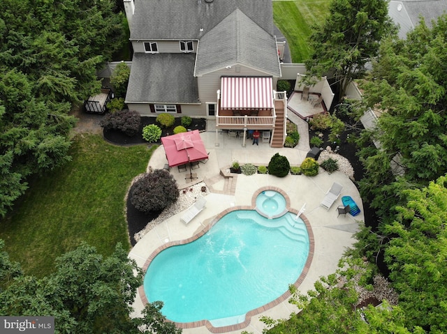 view of pool featuring stairway, a patio area, and a pool with connected hot tub