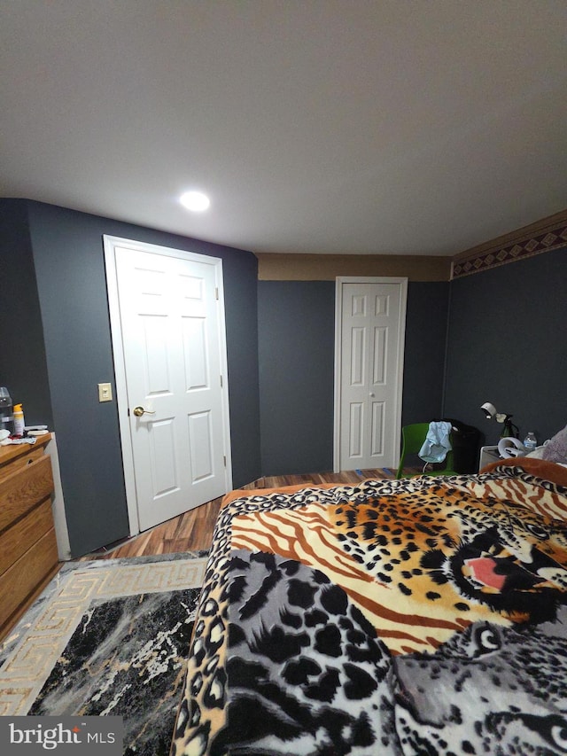 bedroom with wood finished floors