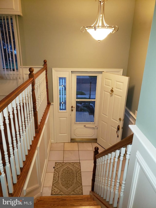 entryway with light tile patterned flooring