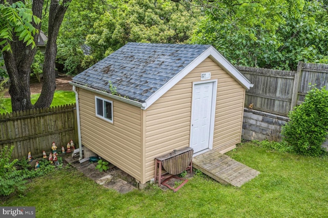 view of shed featuring a fenced backyard