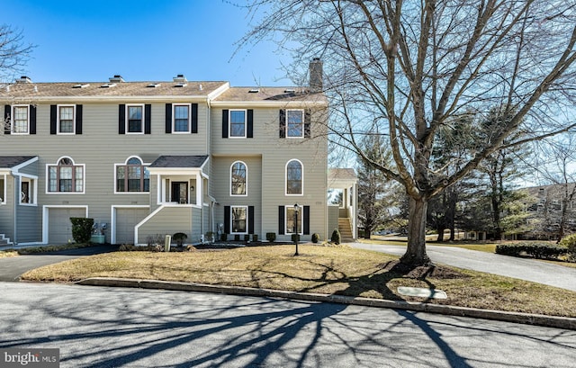 view of front of house featuring an attached garage and driveway