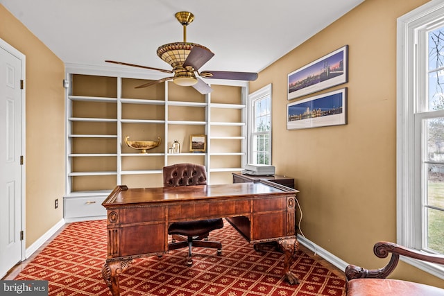 office with plenty of natural light, a ceiling fan, and baseboards