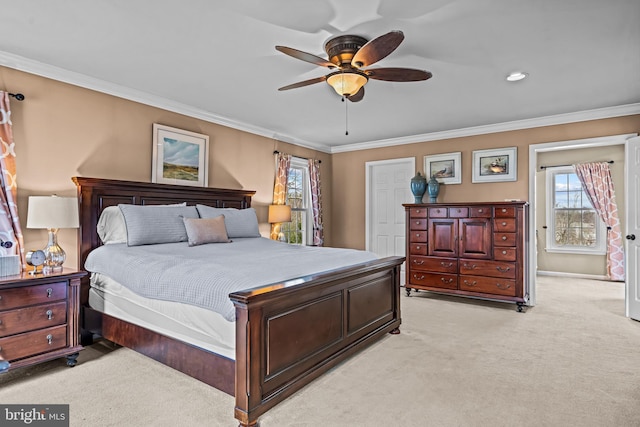 bedroom with light carpet, a ceiling fan, baseboards, and ornamental molding