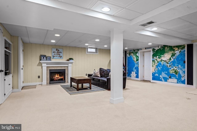 interior space with recessed lighting, carpet, visible vents, and a warm lit fireplace