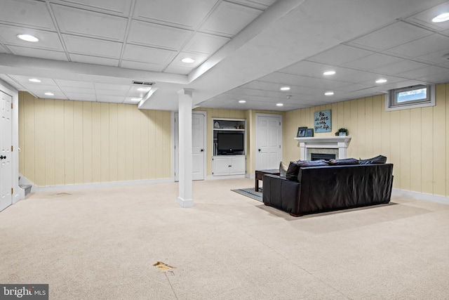 living room with recessed lighting, visible vents, carpet floors, and a fireplace