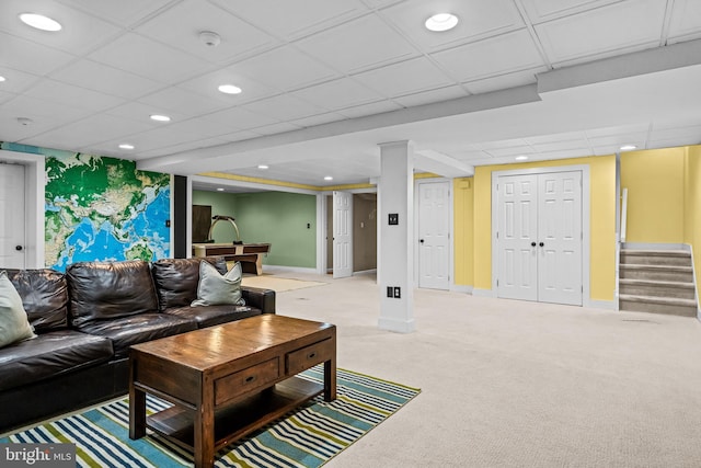 carpeted living room featuring stairway, recessed lighting, a paneled ceiling, and baseboards