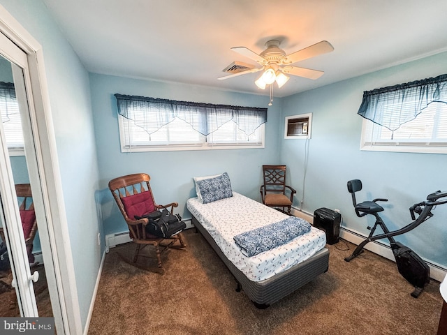 bedroom featuring visible vents, a baseboard heating unit, carpet floors, baseboards, and baseboard heating