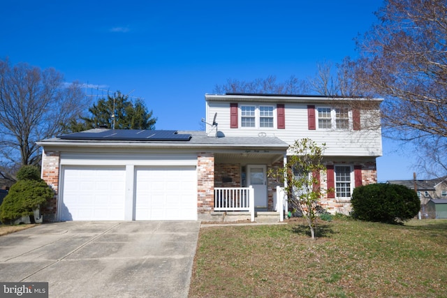 view of front of property with an attached garage, covered porch, a front yard, and brick siding