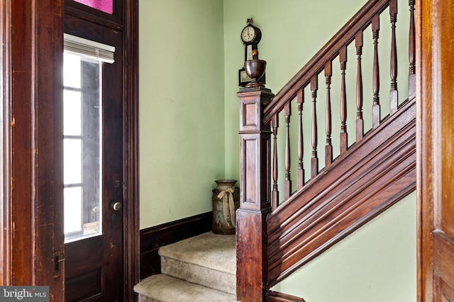 stairway featuring baseboards