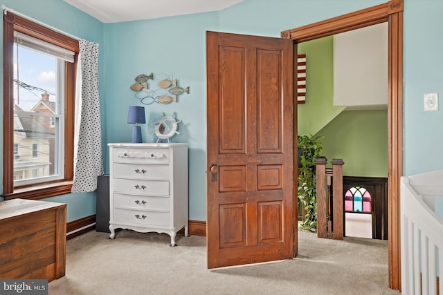 carpeted bedroom with baseboards