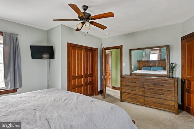 bedroom with light colored carpet and ceiling fan