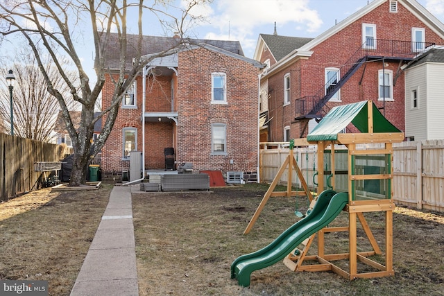 view of playground featuring a fenced backyard