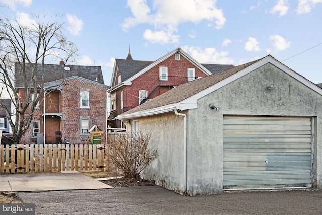 garage featuring fence