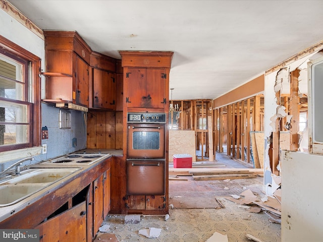 kitchen with a warming drawer, white stovetop, a sink, open shelves, and backsplash