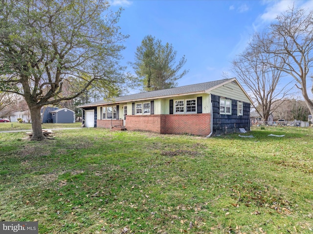 single story home featuring brick siding, an attached garage, and a front yard