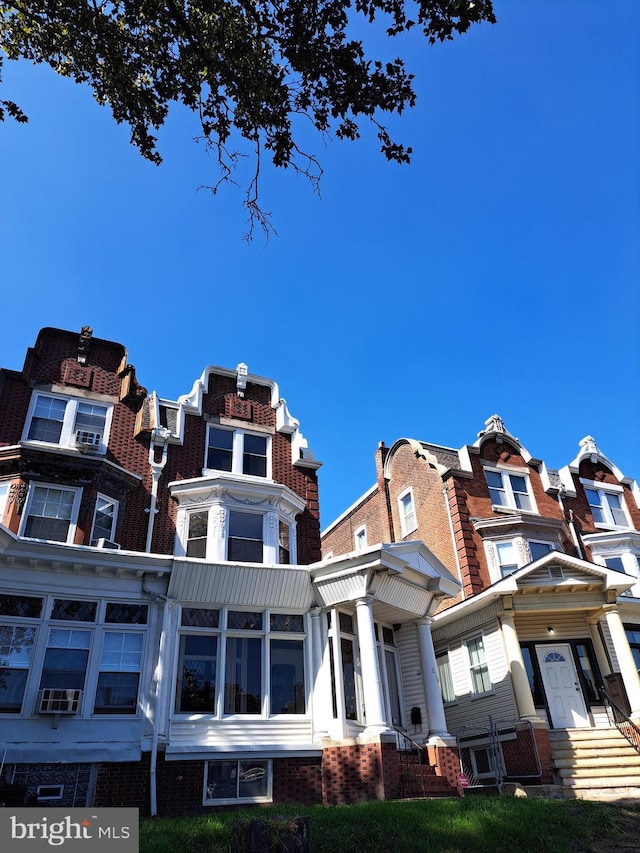 view of front of house with brick siding