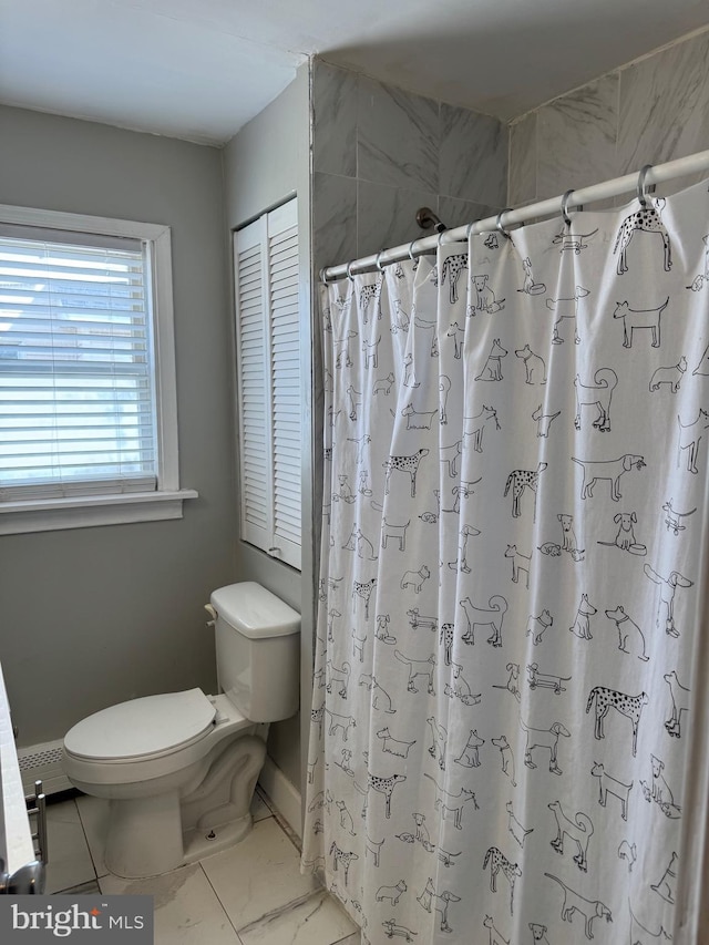 full bathroom featuring a shower with shower curtain, toilet, and marble finish floor