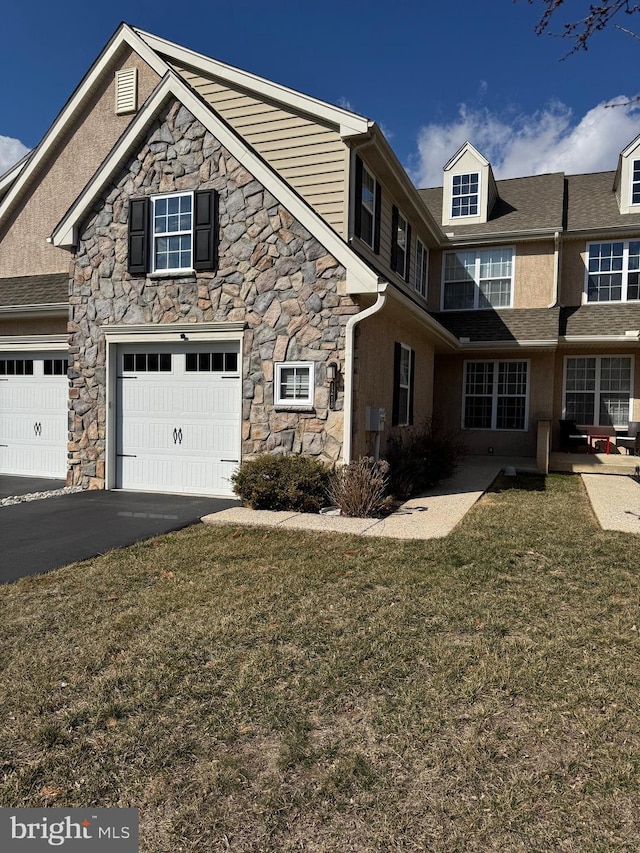 view of home's exterior featuring driveway, an attached garage, a yard, stucco siding, and stone siding