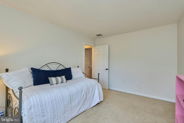 bedroom with visible vents, baseboards, and light colored carpet