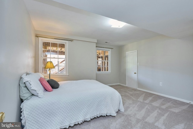 bedroom with carpet flooring and baseboards