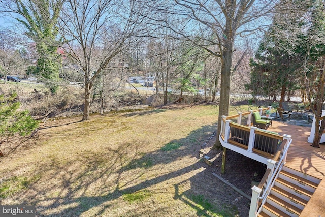 view of yard featuring a wooden deck