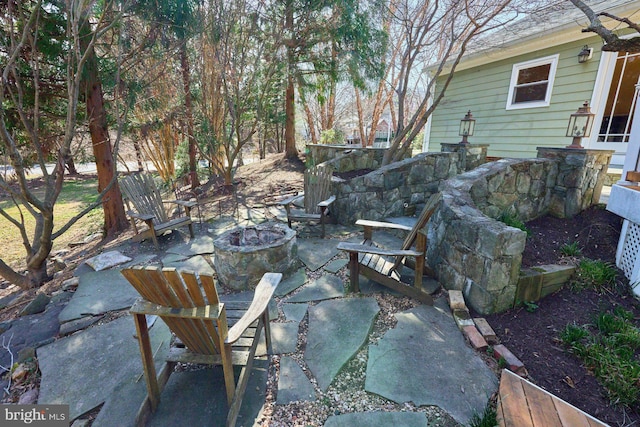 view of patio with a fire pit