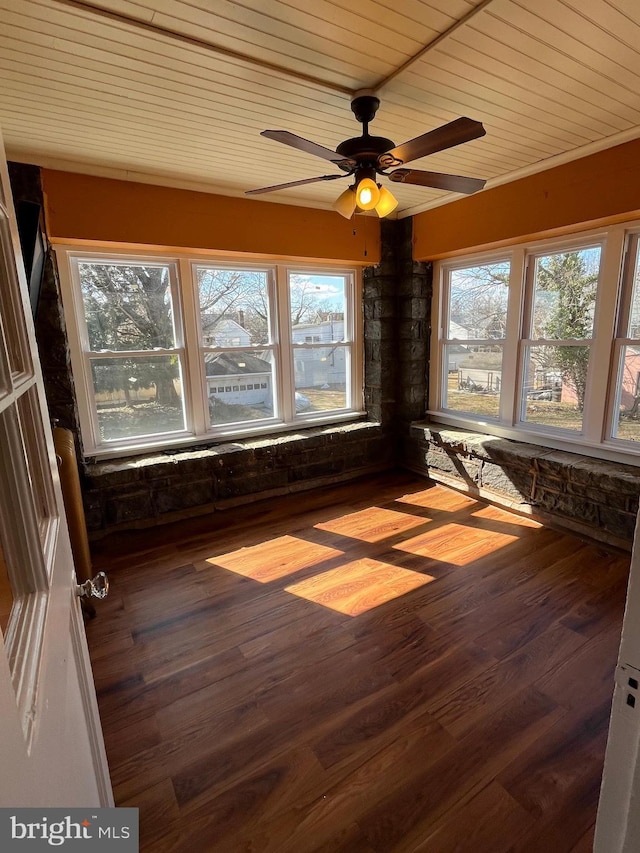 unfurnished sunroom featuring wooden ceiling