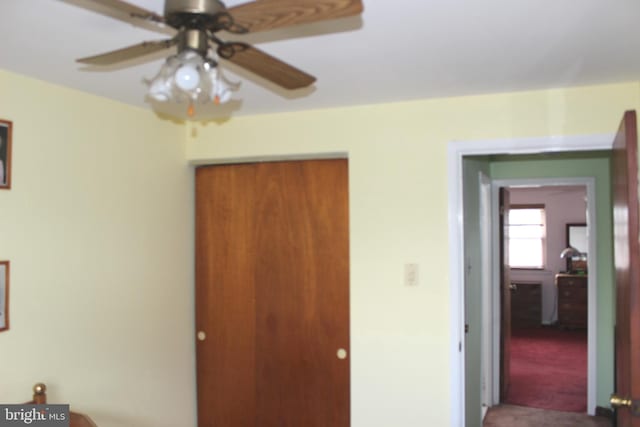 unfurnished bedroom featuring a closet and carpet flooring