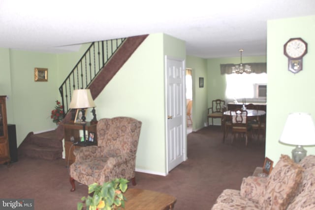 living room with a notable chandelier, carpet, and stairs