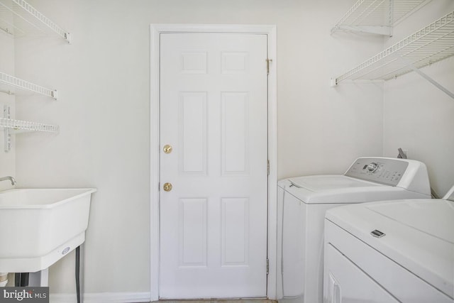 washroom featuring laundry area and separate washer and dryer