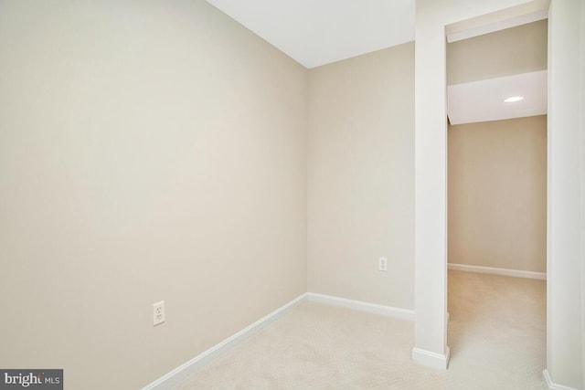 unfurnished room with carpet and baseboards