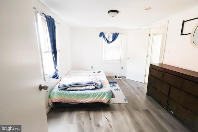 bedroom featuring wood finished floors