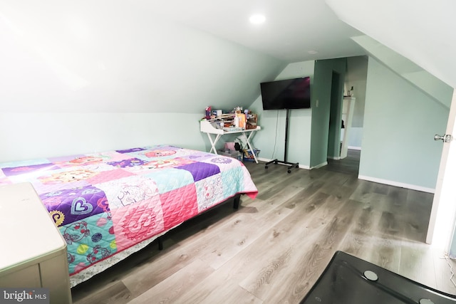 bedroom featuring recessed lighting, baseboards, lofted ceiling, and wood finished floors