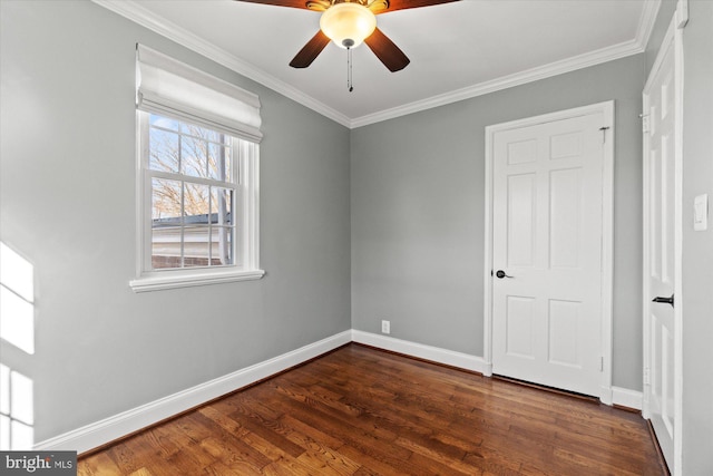 unfurnished bedroom featuring ceiling fan, crown molding, dark wood-type flooring, and baseboards