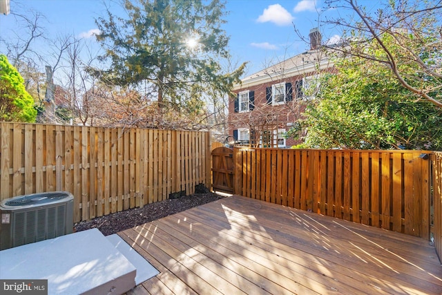 deck featuring central AC unit and a fenced backyard