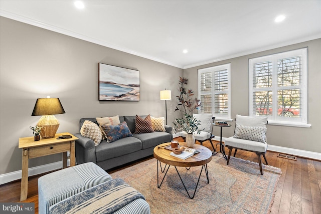 living room with visible vents, baseboards, recessed lighting, ornamental molding, and wood-type flooring