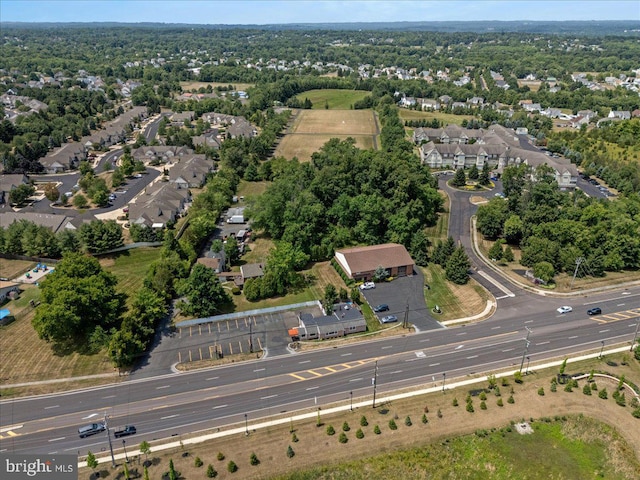 birds eye view of property with a residential view