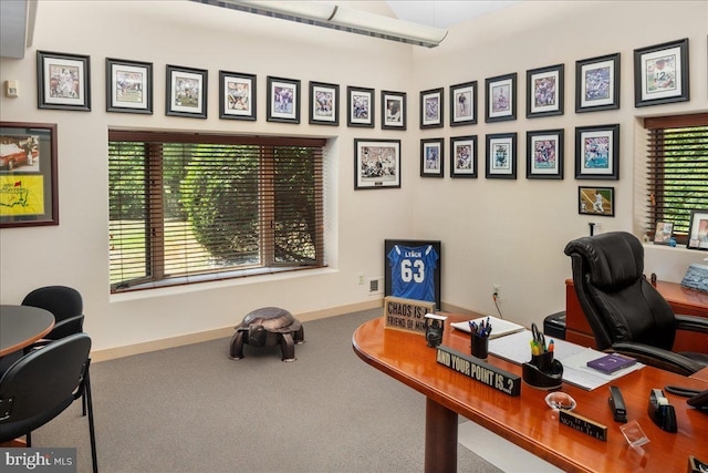 carpeted office with baseboards