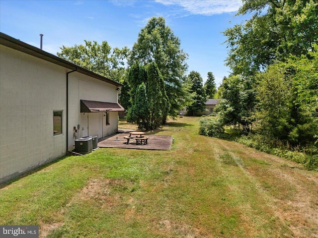 view of yard with a patio area and an outdoor fire pit