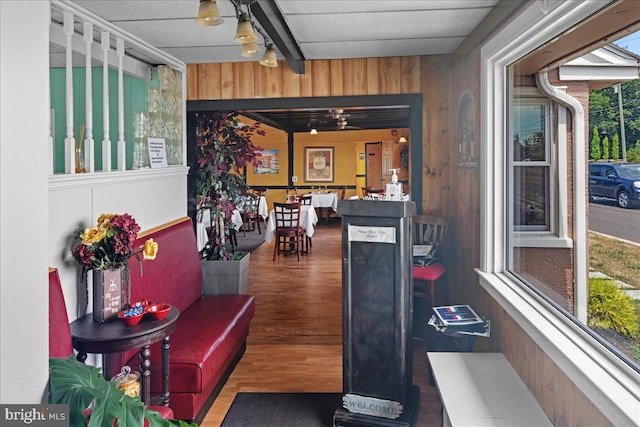 interior space featuring wooden walls and wood finished floors