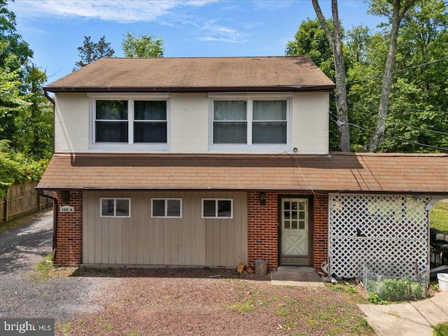 view of front of house featuring fence